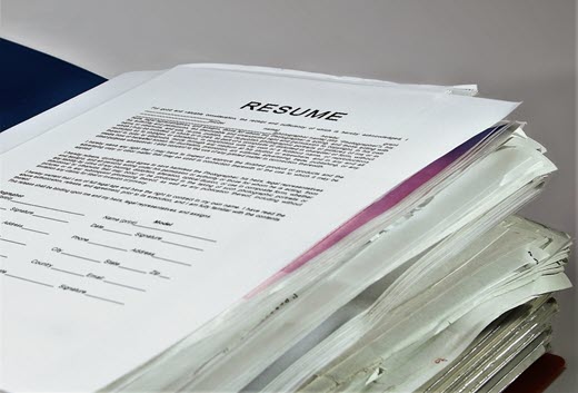 resume on top of pile of other papers